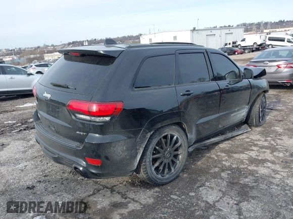 2017 Jeep Grand Cherokee SRT with VIN 1C4RJFDJ7HC641926, listed as a IAAI auction lot 41272215 with 117,667 mi miles. Bid and sale history available at carsss.com. Image 4.
