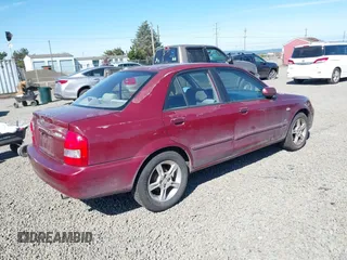 2003 Mazda Protege DX with VIN JM1BJ225930195479, listed as a IAAI auction lot 42199689 with 148,382 mi miles and . Bid and sale history available at DreamBid. Image 4.