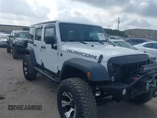 2011 Jeep Wrangler Unlimited Rubicon with VIN 1J4BA6H10BL536027, listed as a IAAI auction lot 42169397 with 164,487 mi miles and . Bid and sale history available at DreamBid. Image 1.