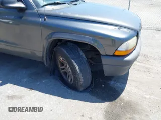 2003 Dodge Dakota with VIN 1D7FL16X53S361797, listed as a IAAI auction lot 42056555 with 243,771 mi miles and . Bid and sale history available at carsss.com. Image 6.