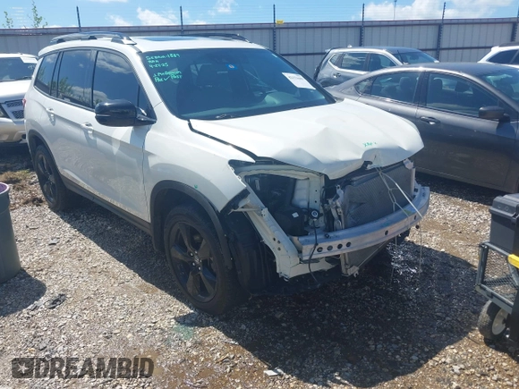 2019 Honda Passport Elite z VIN 5FNYF8H0XKB000774, wystawiony jako IAAI lot #42153669 z przebiegiem 65 415 mil mil oraz . Historia ofert i sprzedaży dostępna na DreamBid. Obrazek 1.