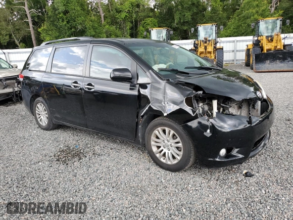2012 Toyota Sienna XLE AAS with VIN 5TDYK3DC1CS279236, listed as a Copart auction lot 63329165 with 143,937 mi miles and Salvage title. Bid and sale history available at DreamBid. Image 4.