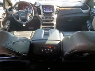 2015 GMC Yukon Denali z VIN 1GKS2CKJ6FR706151, wystawiony jako Copart lot #50556805 z przebiegiem 174 259 mil mil oraz Czysty tytuł • Clean title. Historia ofert i sprzedaży dostępna na DreamBid. Obrazek 8.