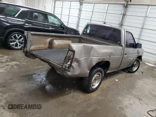 1987 Nissan Hardbody E z VIN JN6ND11S3HW057122, wystawiony jako Copart lot #73303004 z przebiegiem 233 309 mil mil oraz Szkody całkowita. Historia ofert i sprzedaży dostępna na DreamBid. Obrazek 3.