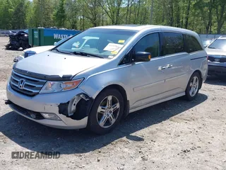 2012 Honda Odyssey Touring with VIN 5FNRL5H96CB043939, listed as a IAAI auction lot 41983643 with 202,535 mi miles. Bid and sale history available at carsss.com. Image 2.