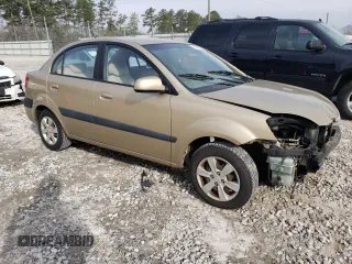 2009 Kia Rio LX with VIN KNADE223296470687, listed as a Copart auction lot 48385925 with 176,400 mi miles and Salvage Title. Bid and sale history available at DreamBid. Image 4.