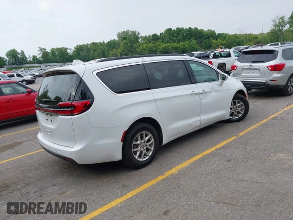 2022 Chrysler Pacifica Touring L with VIN 2C4RC1BG3NR149675, listed as a IAAI auction lot 42470593 with 59,956 mi miles and . Bid and sale history available at DreamBid. Image 4.
