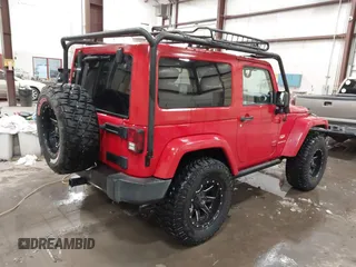 2011 Jeep Wrangler Sahara with VIN 1J4AA5D10BL593534, listed as a IAAI auction lot 41551416 with 101,716 mi miles and . Bid and sale history available at DreamBid. Image 4.