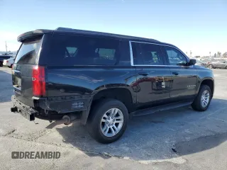 2017 Chevrolet Suburban LS with VIN 1GNSCGECXHR351539, listed as a Copart auction lot 87070214 with 246,129 mi miles and Salvage title. Bid and sale history available at DreamBid. Image 3.