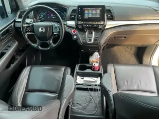 2019 Honda Odyssey Touring z VIN 5FNRL6H86KB053432, wystawiony jako Copart lot #65482425 z przebiegiem 87 470 mil mil oraz Szkoda całkowita • Salvage title. Historia ofert i sprzedaży dostępna na DreamBid. Obrazek 9.
