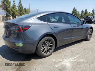 2023 Tesla Model 3 with VIN 5YJ3E1EA4PF615975, listed as a Copart auction lot 58845405 with 38,927 mi miles and Salvage title. Bid and sale history available at DreamBid. Image 3.