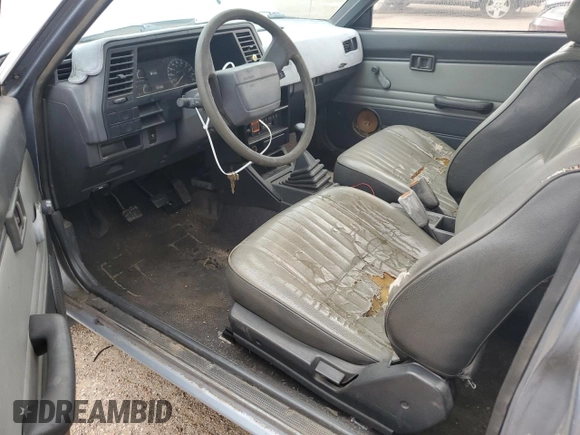 1987 Nissan Sentra z VIN JN1PB2210HU557007, wystawiony jako Copart lot #68174784 z przebiegiem 150 316 mil mil oraz Czysty tytuł • Clean title. Historia ofert i sprzedaży dostępna na DreamBid. Obrazek 8.