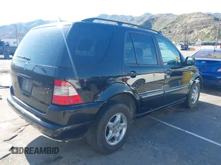 2001 Mercedes-Benz M-Class with VIN 4JGAB54E01A272539, listed as a IAAI auction lot 42124321 with 272,098 mi miles. Bid and sale history available at carsss.com. Image 4.