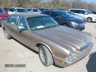 1998 Jaguar XJ Vanden Plas with VIN SAJKX6242WC823240, listed as a IAAI auction lot 41605734 with Not Provided miles and . Bid and sale history available at DreamBid. Image 1.