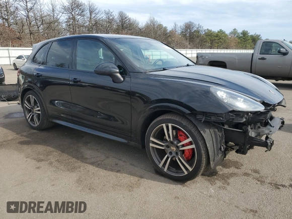 2013 Porsche Cayenne GTS с VIN WP1AD2A29DLA72323, выставлен на аукционе Copart как лот 52990885 с пробегом 100 812 миль миль и Списание • Salvage title. История ставок и продаж доступна на DreamBid. Изображение 4.