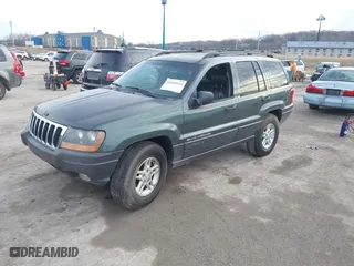2003 Jeep Grand Cherokee Laredo with VIN 1J4GW48S93C583644, listed as a IAAI auction lot 41656314 with 256,653 mi miles. Bid and sale history available at carsss.com. Image 2.
