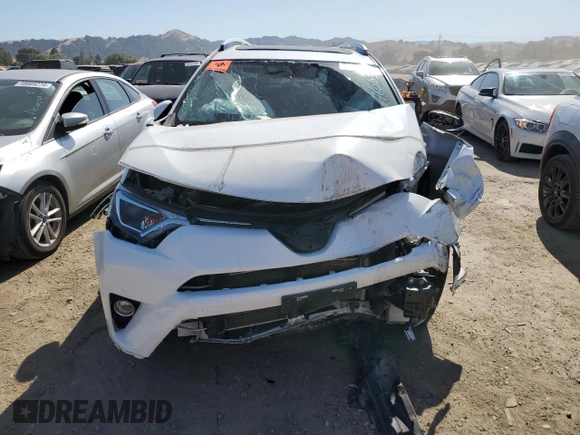2016 Toyota RAV4 Hybrid XLE with VIN JTMRJREV2GD058966, listed as a Copart auction lot 58908824 with 0 mi miles and Salvage Title. Bid and sale history available at carsss.com. Image 5.