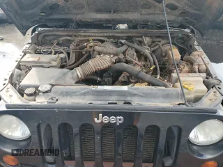 2011 Jeep Wrangler Sport z VIN 1J4GA2D16BL511735, wystawiony jako Copart lot #63292705 z przebiegiem 136 609 mil mil oraz Szkoda całkowita • Salvage title. Historia ofert i sprzedaży dostępna na DreamBid. Obrazek 12.