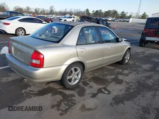 2003 Mazda Protege DX with VIN JM1BJ225X31160766, listed as a IAAI auction lot 41941361 with 190,125 mi miles and . Bid and sale history available at DreamBid. Image 4.