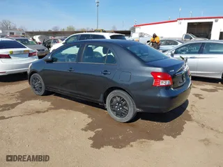 2009 Toyota Yaris with VIN JTDBT903194047784, listed as a IAAI auction lot 42049872 with 115,735 mi miles. Bid and sale history available at carsss.com. Image 3.
