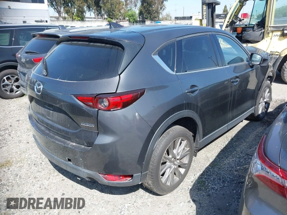 2020 Mazda CX-5 Grand Touring with VIN JM3KFADM7L0766278, listed as a IAAI auction lot 41297902 with 1 mi miles. Bid and sale history available at carsss.com. Image 4.