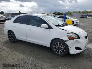 2010 Toyota Yaris with VIN JTDBT4K3XA1360659, listed as a Copart auction lot 51490475 with 210,967 mi miles and Salvage Title. Bid and sale history available at carsss.com. Image 4.