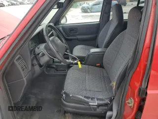 1999 Jeep Cherokee Sport with VIN 1J4FF68S3XL667570, listed as a Copart auction lot 52821105 with 173,712 mi miles and Salvage Title. Bid and sale history available at DreamBid. Image 7.