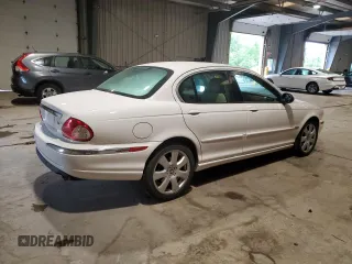 2004 Jaguar X-Type with VIN SAJEA51C34WE06046, listed as a Copart auction lot 56982105 with 69,265 mi miles and Clean Title. Bid and sale history available at DreamBid. Image 3.