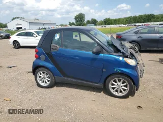 2009 Smart fortwo Pure with VIN WMEEJ31X59K218003, listed as a Copart auction lot 62413775 with 82,711 mi miles and Salvage title. Bid and sale history available at DreamBid. Image 4.