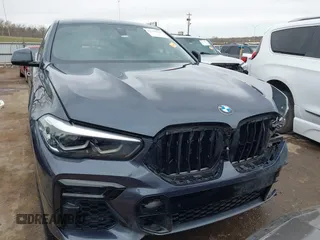 2022 BMW X6 xDrive40i z VIN 5UXCY6C08N9N30013, wystawiony jako IAAI lot #41772245 z przebiegiem 23 198 mil mil oraz . Historia ofert i sprzedaży dostępna na DreamBid. Obrazek 13.