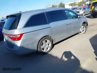 2011 Honda Odyssey Touring with VIN 5FNRL5H9XBB012899, listed as a IAAI auction lot 41611879 with 171,041 mi miles. Bid and sale history available at carsss.com. Image 4.