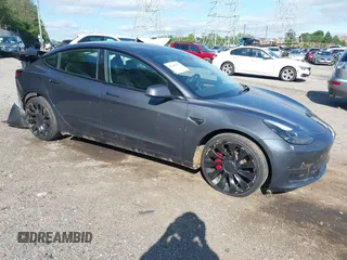 2023 Tesla Model 3 Performance z VIN 5YJ3E1ECXPF482320, wystawiony jako IAAI lot #42289417 z przebiegiem 31 296 mil mil oraz . Historia ofert i sprzedaży dostępna na DreamBid. Obrazek 1.