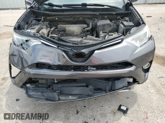 2016 Toyota RAV4 XLE with VIN 2T3RFREV0GW412875, listed as a Copart auction lot 59497545 with 226,604 mi miles and Salvage title. Bid and sale history available at DreamBid. Image 12.
