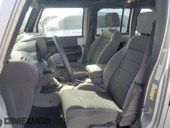 2007 Jeep Wrangler Unlimited X with VIN 1J8GB39157L142982, listed as a Copart auction lot 82050134 with 72,666 mi miles and Salvage Title. Bid and sale history available at DreamBid. Image 7.