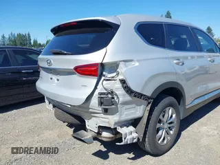 2019 Hyundai Santa Fe SE with VIN 5NMS2CAD9KH122140, listed as a IAAI auction lot 42616171 with 50,794 mi miles and . Bid and sale history available at DreamBid. Image 6.