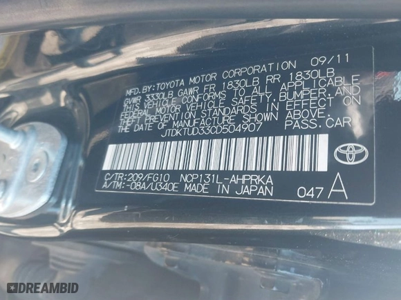 2012 Toyota Yaris L with VIN JTDKTUD33CD504907, listed as a IAAI auction lot 41587510 with 242,307 mi miles. Bid and sale history available at carsss.com. Image 9.