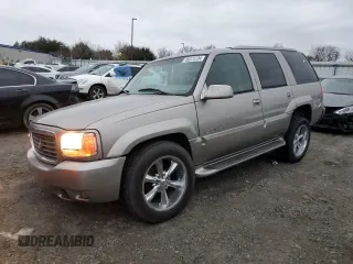 2000 Cadillac Escalade z VIN 1GYEK63R5YR219759, wystawiony jako Copart lot #86373734 z przebiegiem 190 307 mil mil oraz Szkoda całkowita • Salvage title. Historia ofert i sprzedaży dostępna na DreamBid. Obrazek 1.