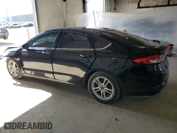 2018 Ford Fusion SE z VIN 3FA6P0HDXJR130677, wystawiony jako Copart lot #51737345 z przebiegiem 129 918 mil mil oraz Szkoda całkowita • Salvage title. Historia ofert i sprzedaży dostępna na DreamBid. Obrazek 2.