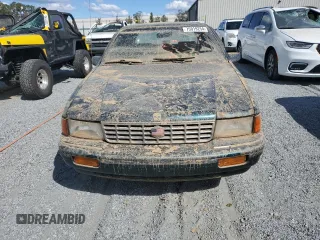1993 Plymouth Acclaim z VIN 1P3XA4634PF673210, wystawiony jako Copart lot #75919254 z przebiegiem 186 440 mil mil oraz Szkody całkowita. Historia ofert i sprzedaży dostępna na DreamBid. Obrazek 5.