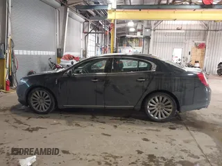 2014 Lincoln MKS with VIN 1LNHL9DK8EG609955, listed as a IAAI auction lot 41580770 with 109,864 mi miles. Bid and sale history available at carsss.com. Image 14.
