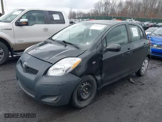 2010 Toyota Yaris with VIN JTDKT4K31A5283852, listed as a IAAI auction lot 41674971 with 197,351 mi miles. Bid and sale history available at carsss.com. Image 2.