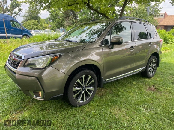2017 Subaru Forester Touring с VIN JF2SJGWC9HH402713, выставлен на аукционе Copart как лот 63635365 с пробегом 128 906 миль миль и Чистый • Clean title. История ставок и продаж доступна на DreamBid. Изображение 2.