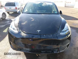 2023 Tesla Model Y Long Range with VIN 7SAYGDEE8PA151965, listed as a IAAI auction lot 41343497 with 25,869 mi miles. Bid and sale history available at carsss.com. Image 6.