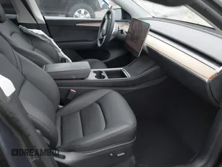 2023 Tesla Model Y Long Range with VIN 7SAYGDEE7PF894362, listed as a IAAI auction lot 41512492 with 27,513 mi miles. Bid and sale history available at carsss.com. Image 5.