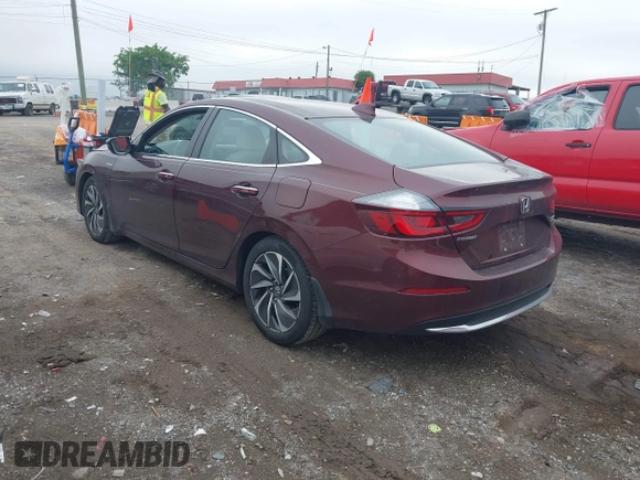 2020 Honda Insight Touring z VIN 19XZE4F93LE010040, wystawiony jako IAAI lot #42240572 z przebiegiem 52 299 mil mil oraz . Historia ofert i sprzedaży dostępna na DreamBid. Obrazek 3.