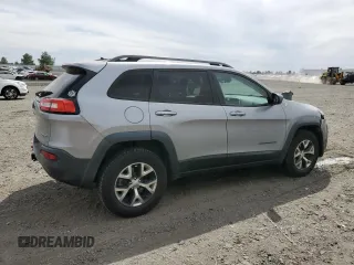 2014 Jeep Cherokee Trailhawk with VIN 1C4PJMBS6EW159174, listed as a Copart auction lot 56097795 with 130,299 mi miles and Salvage title. Bid and sale history available at DreamBid. Image 3.