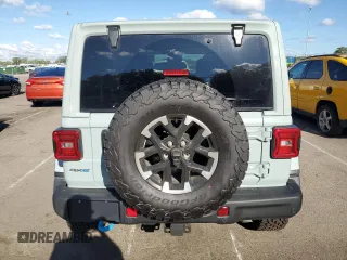2024 Jeep Wrangler Rubicon z VIN 1C4RJXR64RW279791, wystawiony jako Copart lot #61348324 z przebiegiem 1 387 mil mil oraz Szkoda całkowita • Salvage title. Historia ofert i sprzedaży dostępna na DreamBid. Obrazek 6.