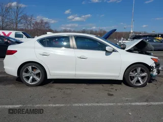 2014 Acura ILX Premium z VIN 19VDE1F57EE010379, wystawiony jako IAAI lot #41886882 z przebiegiem 174 731 mil mil oraz . Historia ofert i sprzedaży dostępna na DreamBid. Obrazek 13.