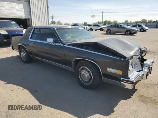 1985 Cadillac Eldorado z VIN 1G6EL5780FE622179, wystawiony jako Copart lot #54109205 z przebiegiem 73 403 mil mil oraz Szkoda całkowita • Salvage title. Historia ofert i sprzedaży dostępna na DreamBid. Obrazek 4.