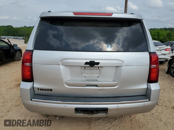 2015 Chevrolet Tahoe LTZ z VIN 1GNSKCKC0FR198361, wystawiony jako Copart lot #54220155 z przebiegiem 176 429 mil mil oraz Szkoda całkowita • Salvage title. Historia ofert i sprzedaży dostępna na DreamBid. Obrazek 6.